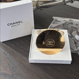 Chanel Beaute New Gold Dual Mirror w/ quilted foam box. New in plastic coating